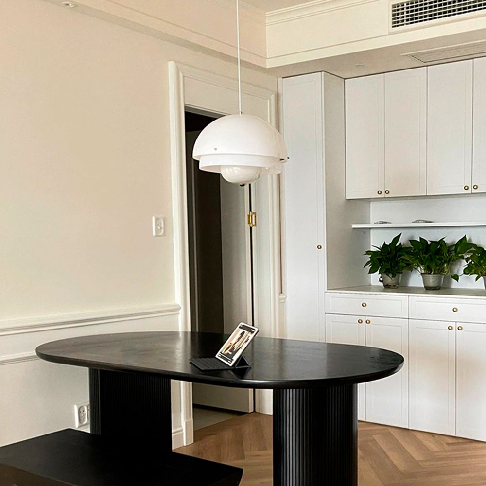 Hailie pendant light above a modern dining table.
