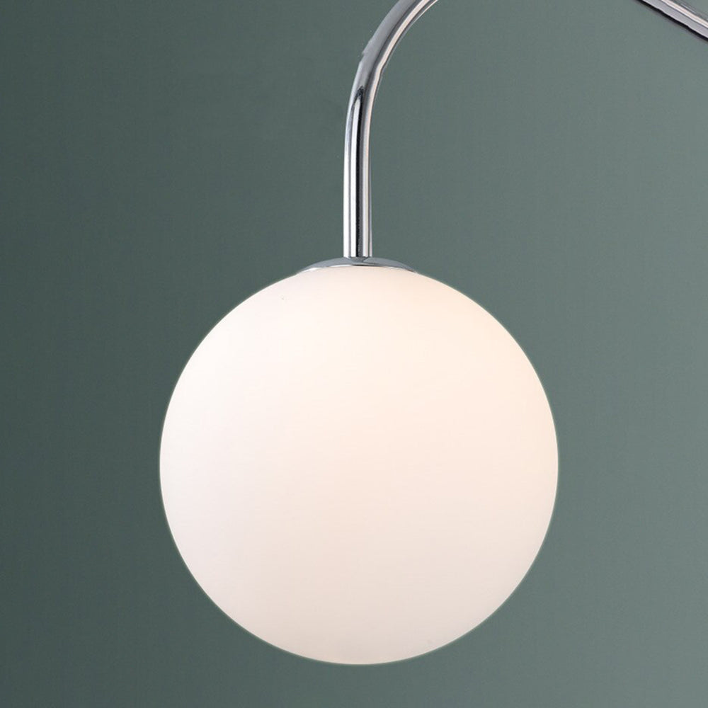 Chrome pendant light with white globe. Modern lighting by Las Sola.