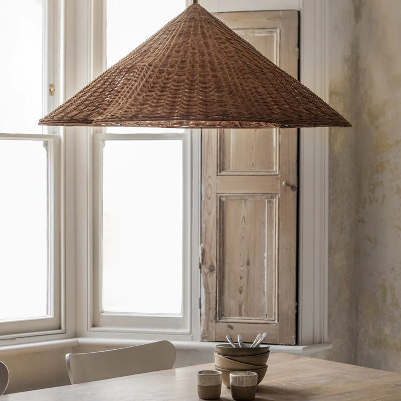 Rattan pendant light over dining table, interior design