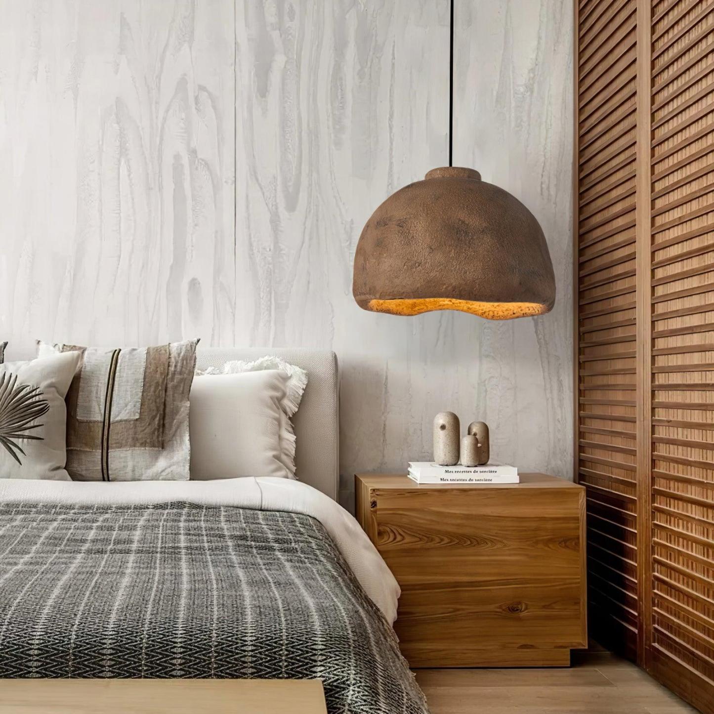 Brown Cairns pendant light in bedroom. Wabi Sabi style.