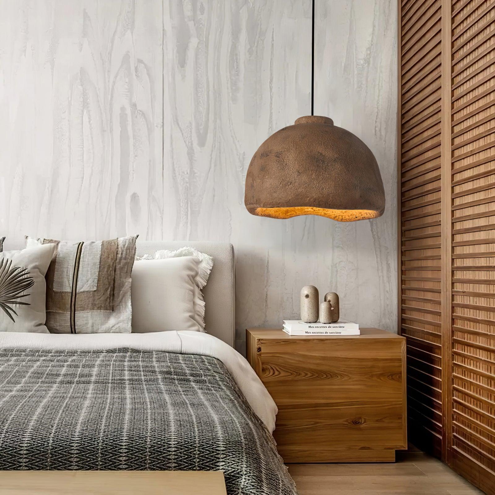 Brown Cairns pendant light in bedroom. Wabi Sabi style.