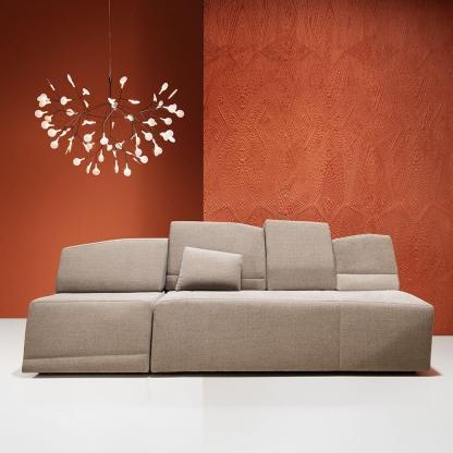 Olivia Sputnik Chandelier above a beige modern sofa