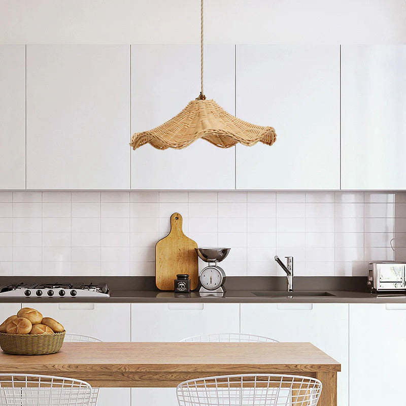 Rattan pendant light in modern kitchen with wooden table