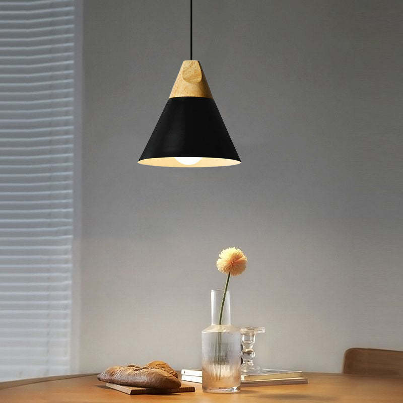 Black Morandi pendant light over dining table, Lassola lighting