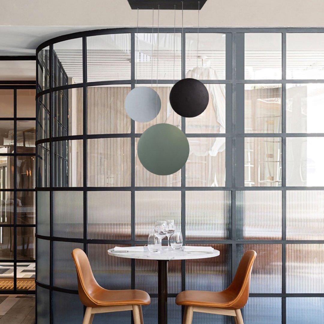 Zaid pendant lights in a restaurant setting, round shape
