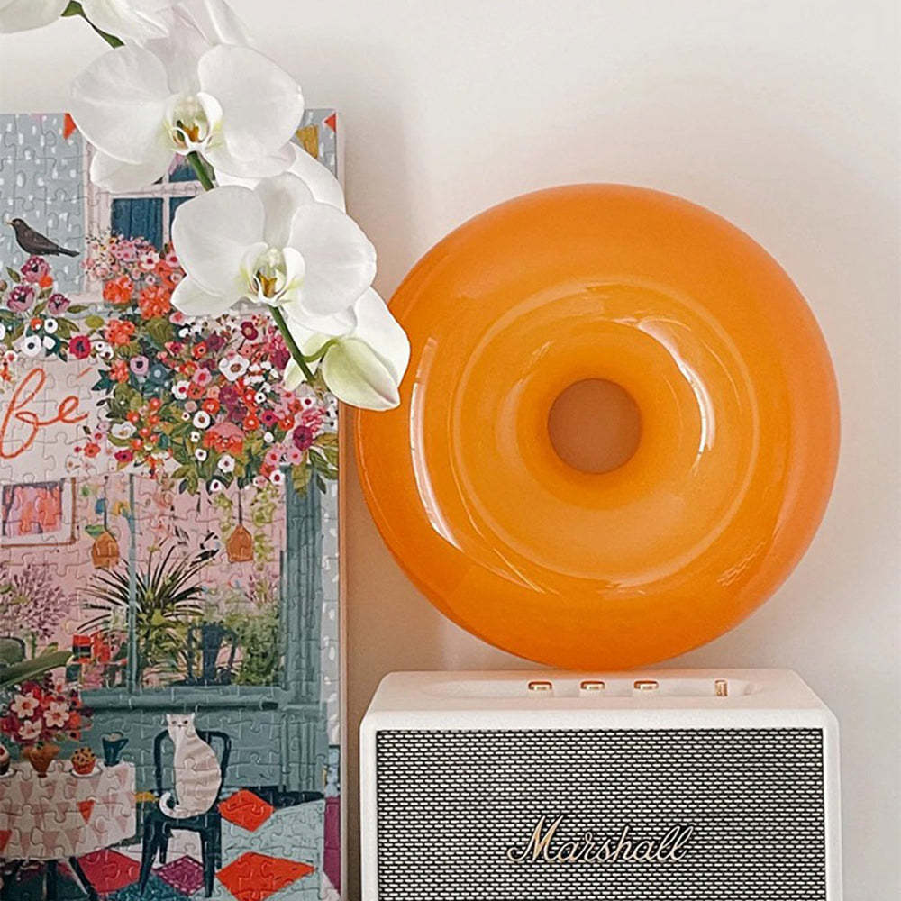 Orange Nielsen LED Wall Lamp, flowers and a Marshall speaker