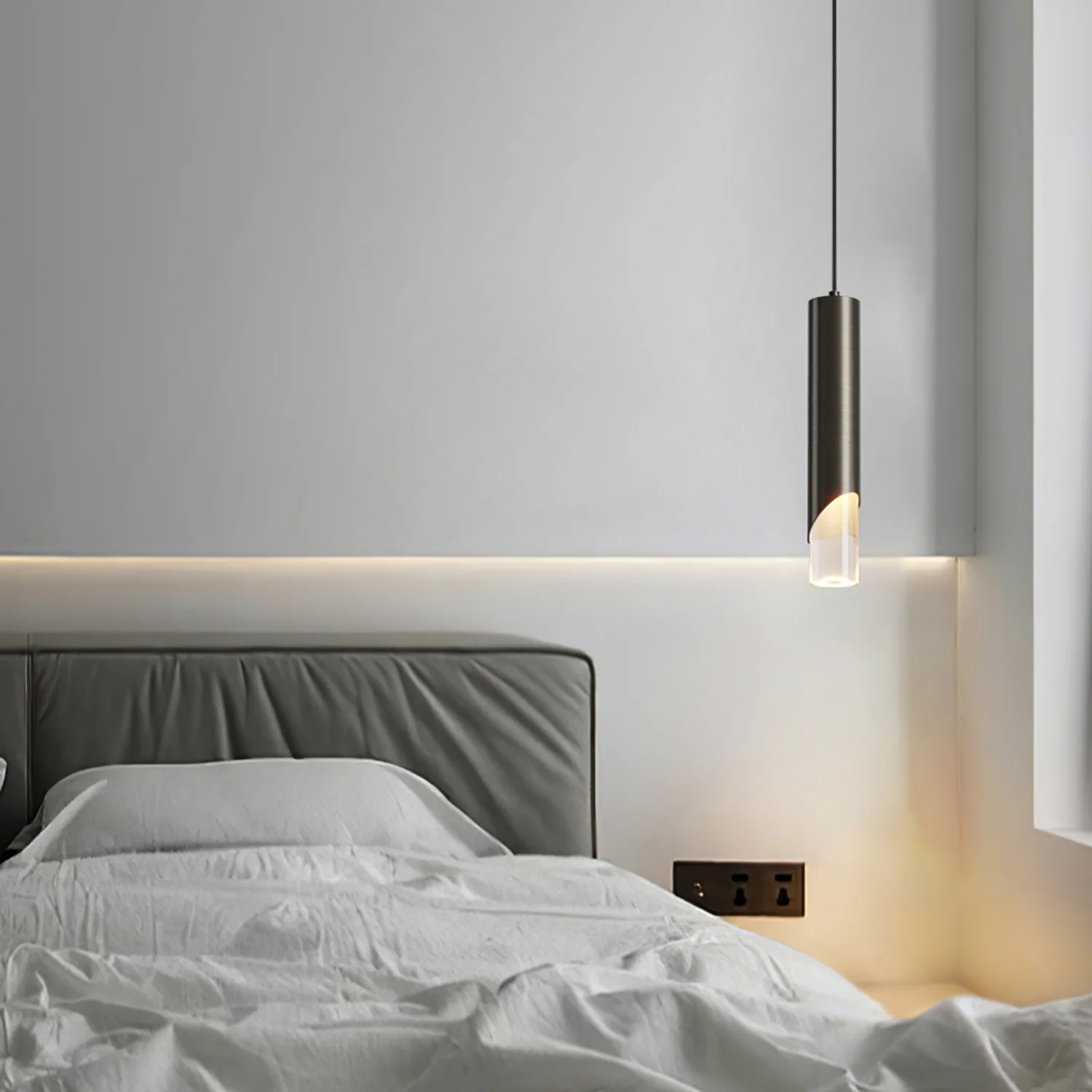Modern cylinder pendant light in a bedroom setting