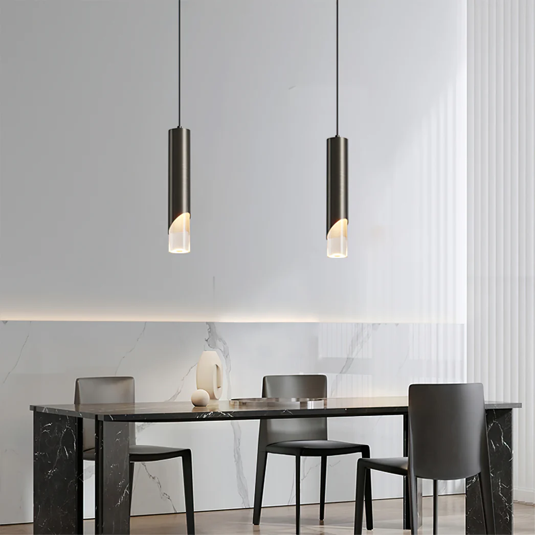 Modern cylinder pendant lights over dining table