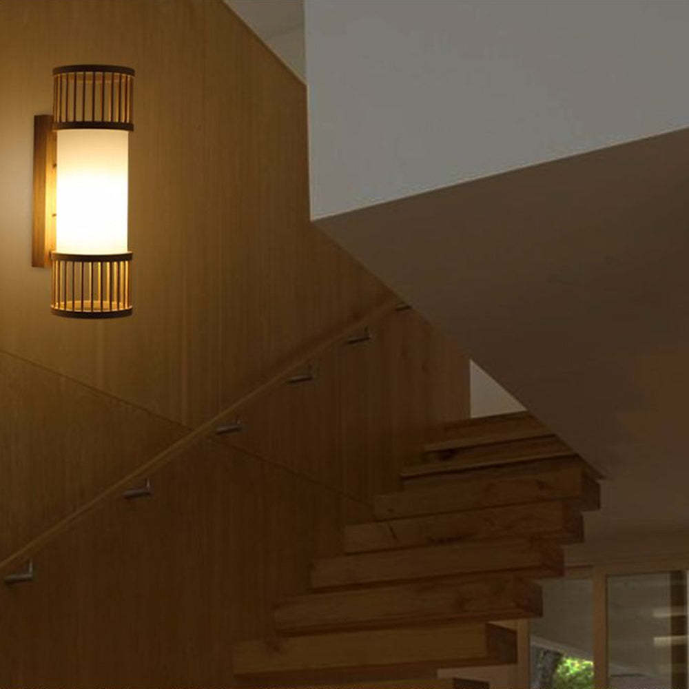 Ozawa rattan wall lamp lighting a staircase.