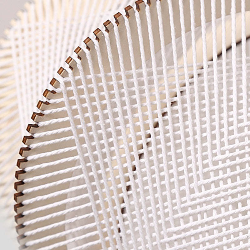 Close-up of Muto Retro Pendant Light detail: rope and wood texture
