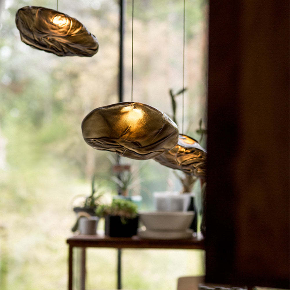 Byers pendant lights over a wooden table.