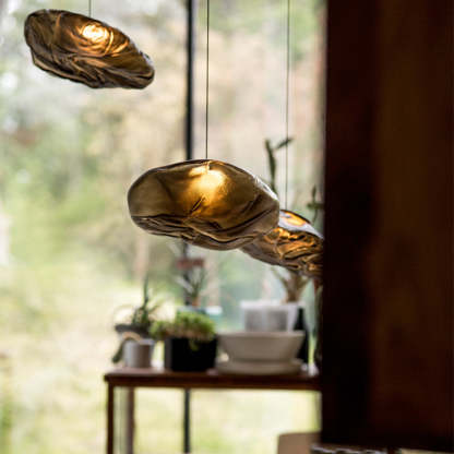 Byers pendant lights over a wooden table.