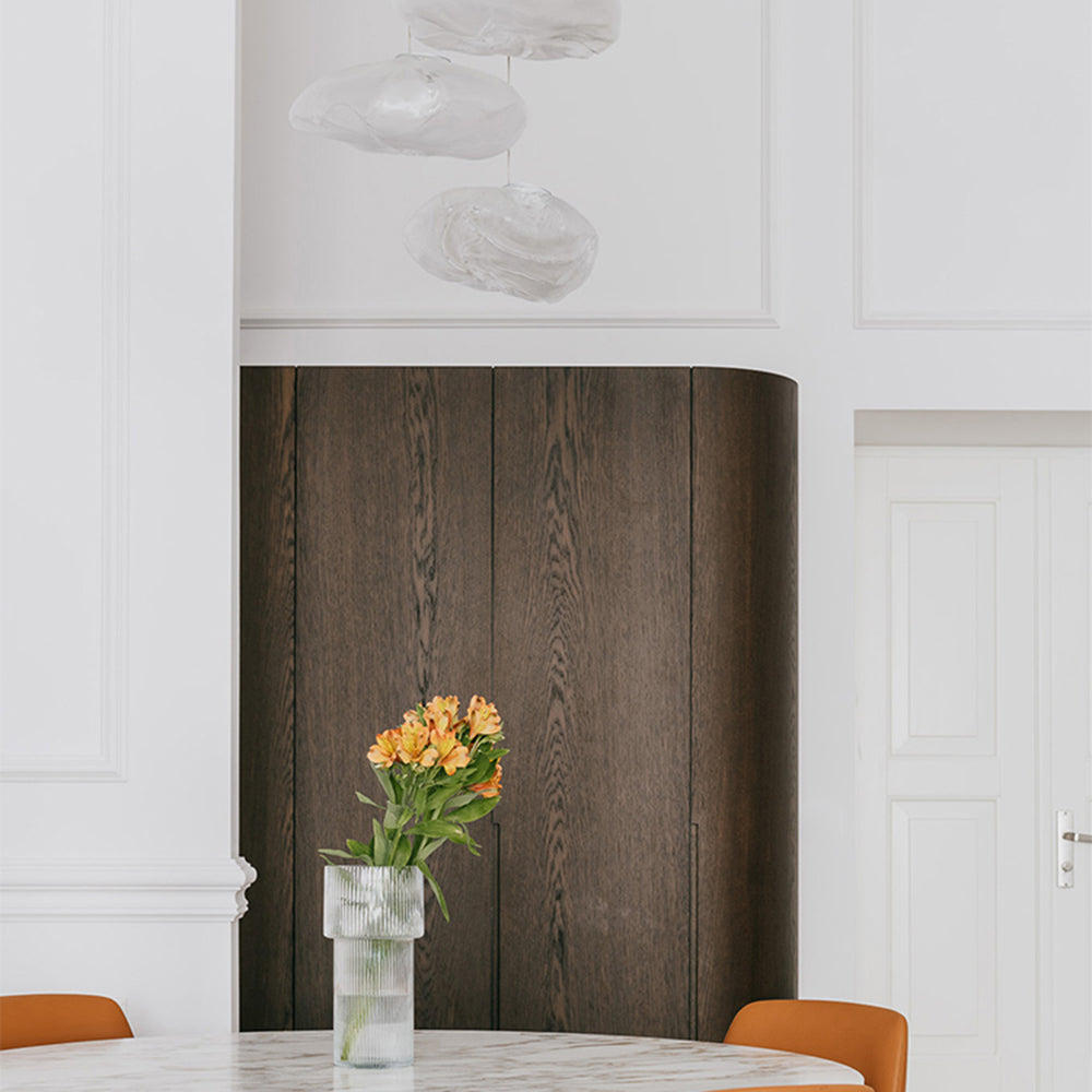 Minimalist Byers pendant lights and flower vase