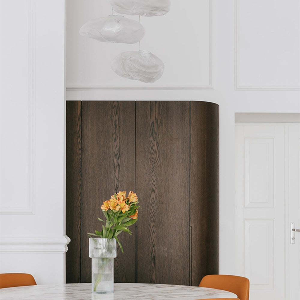 Minimalist Byers pendant lights and flower vase