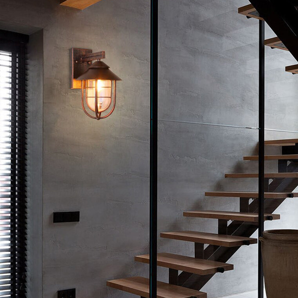 Vintage lantern wall lamp. Alessio outdoor lighting on gray wall.
