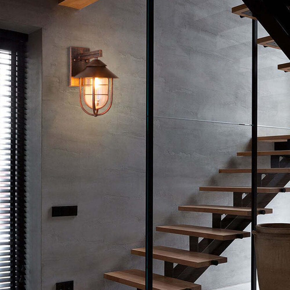 Vintage lantern wall lamp. Alessio outdoor lighting on gray wall.
