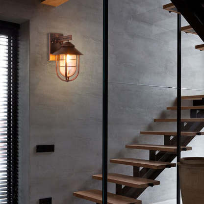 Vintage lantern wall lamp. Alessio outdoor lighting on gray wall.