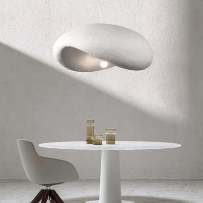 Byers cloud pendant light over modern dining table.
