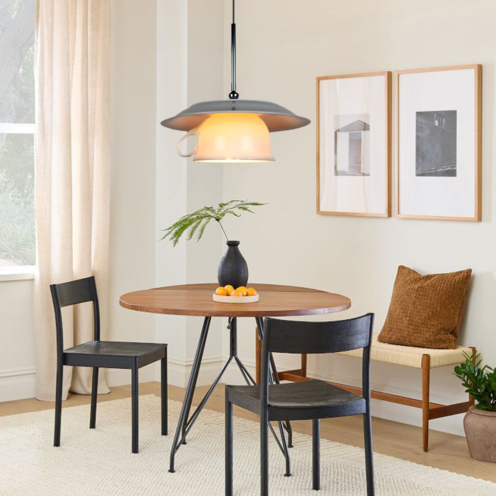 Modern ceramic pendant light over dining table