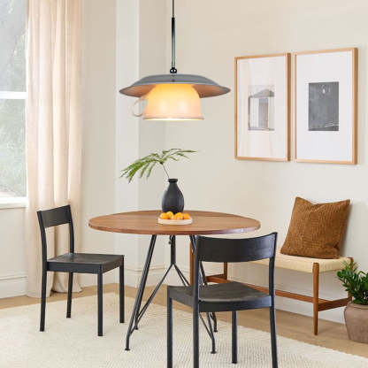 Modern ceramic pendant light over dining table
