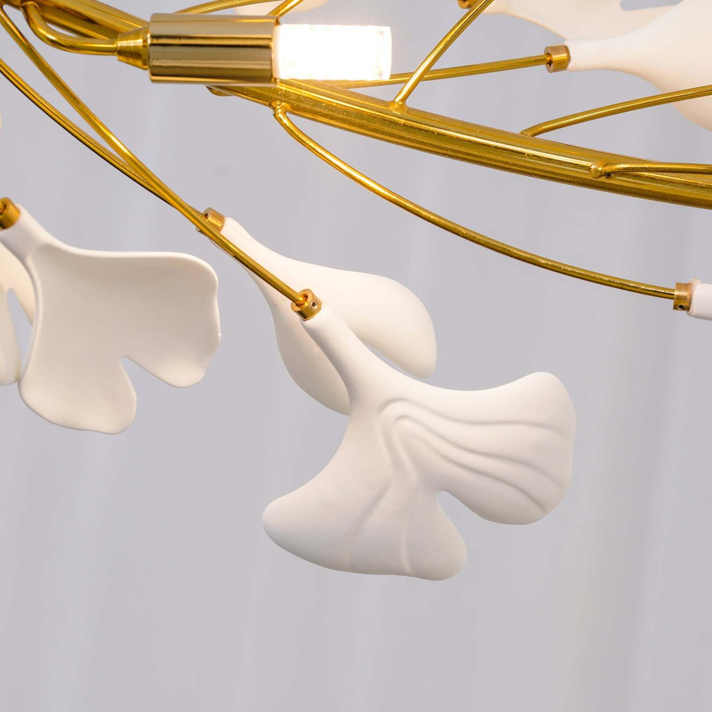 Close-up Olivia GinkLuxe Chandelier, metal and ceramic leaves