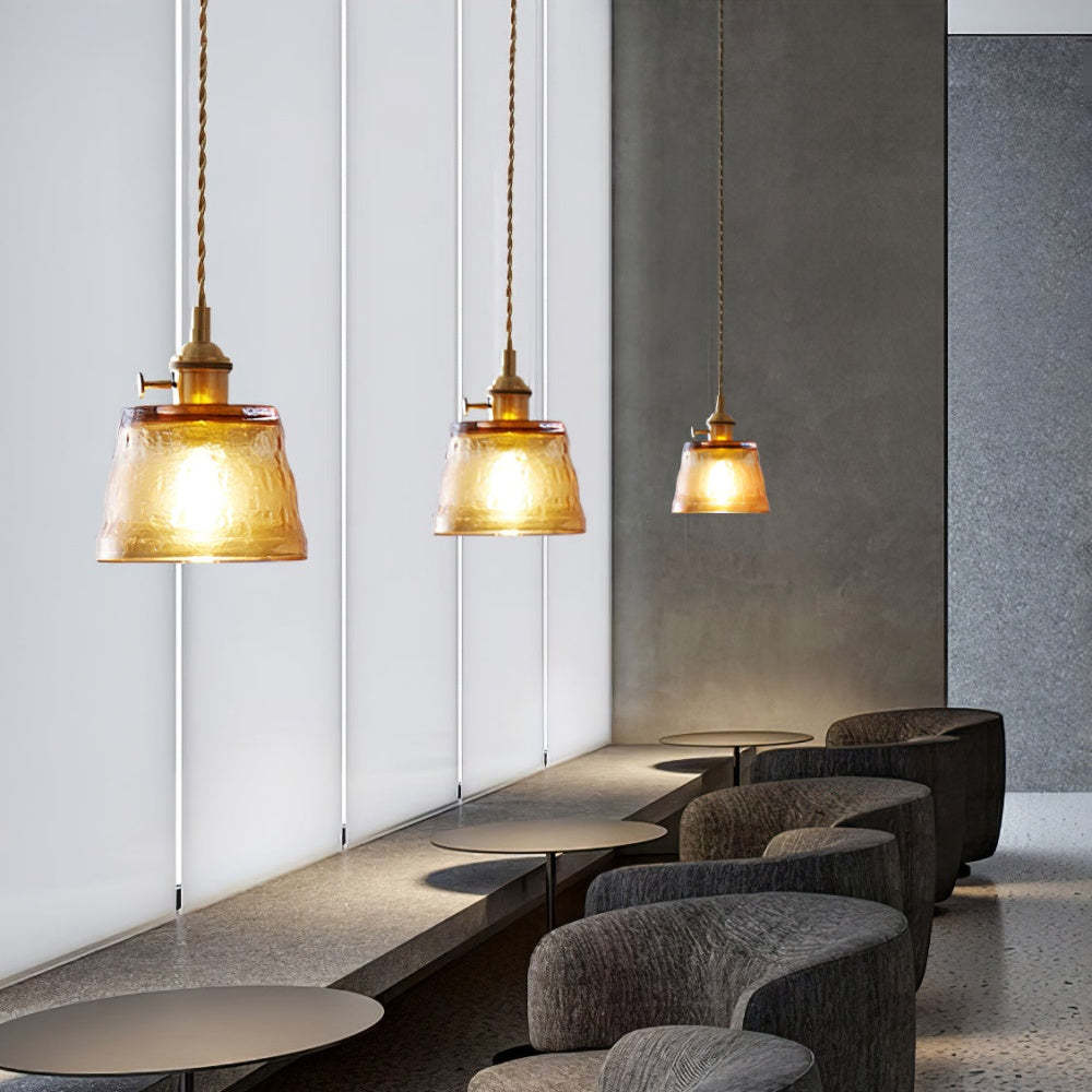 Amber glass pendant lights in a modern dining room