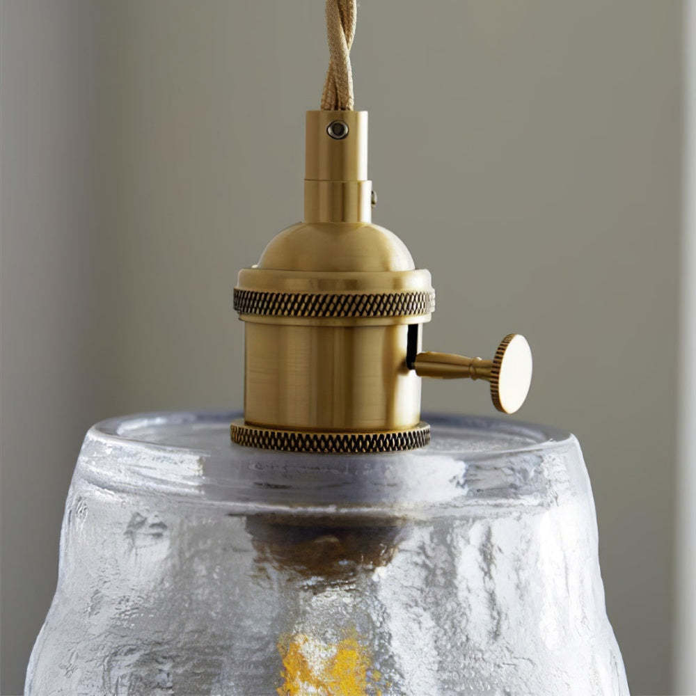 Hailie pendant light detail: textured glass shade and brass fixture