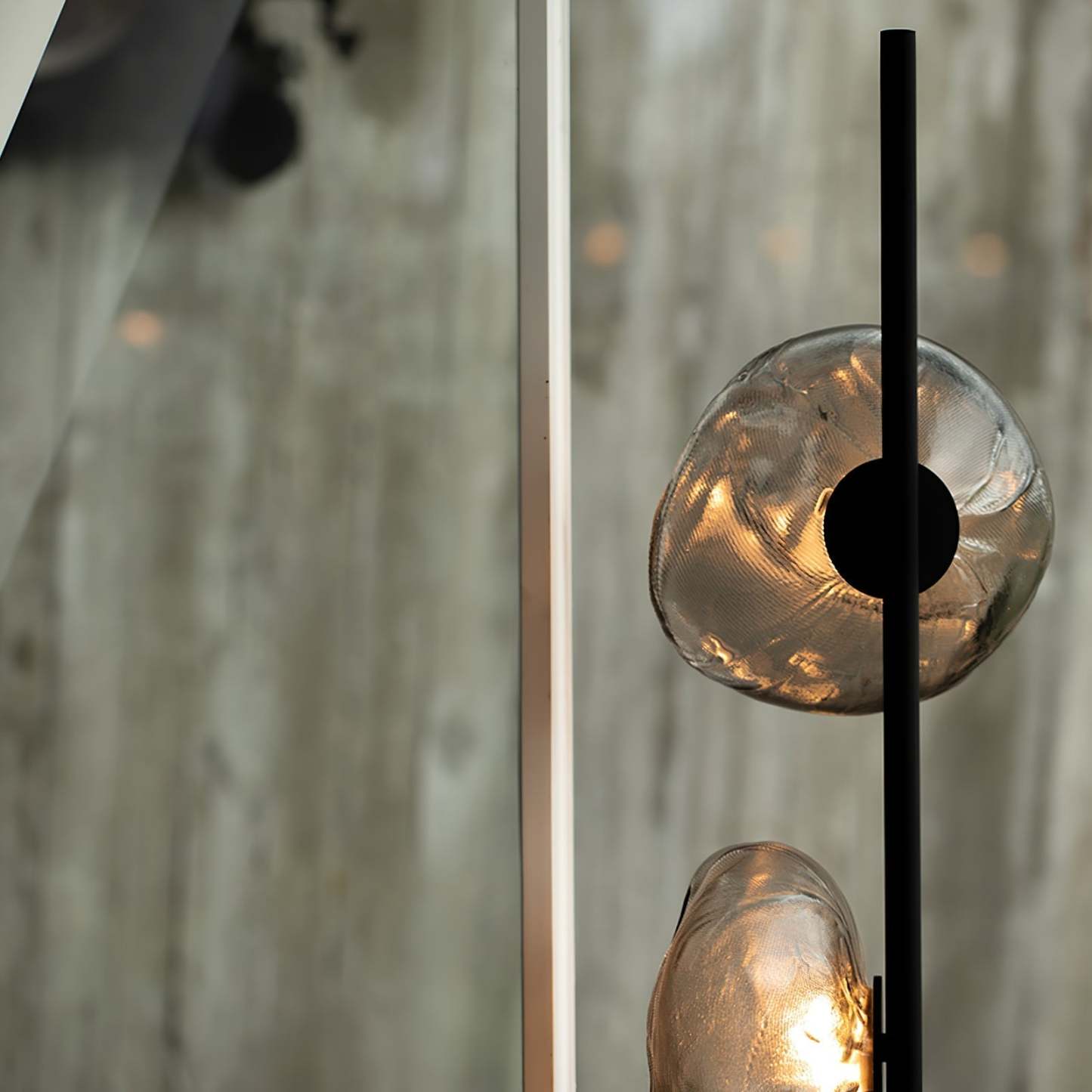 Byres table lamp close-up, irregular glass shades, black metal fixture