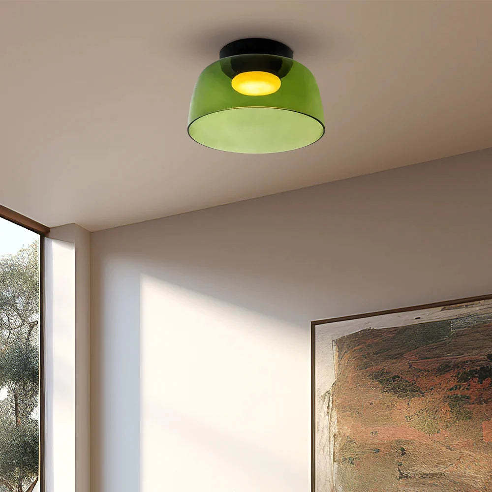 Green glass flush mount ceiling light in a modern living room