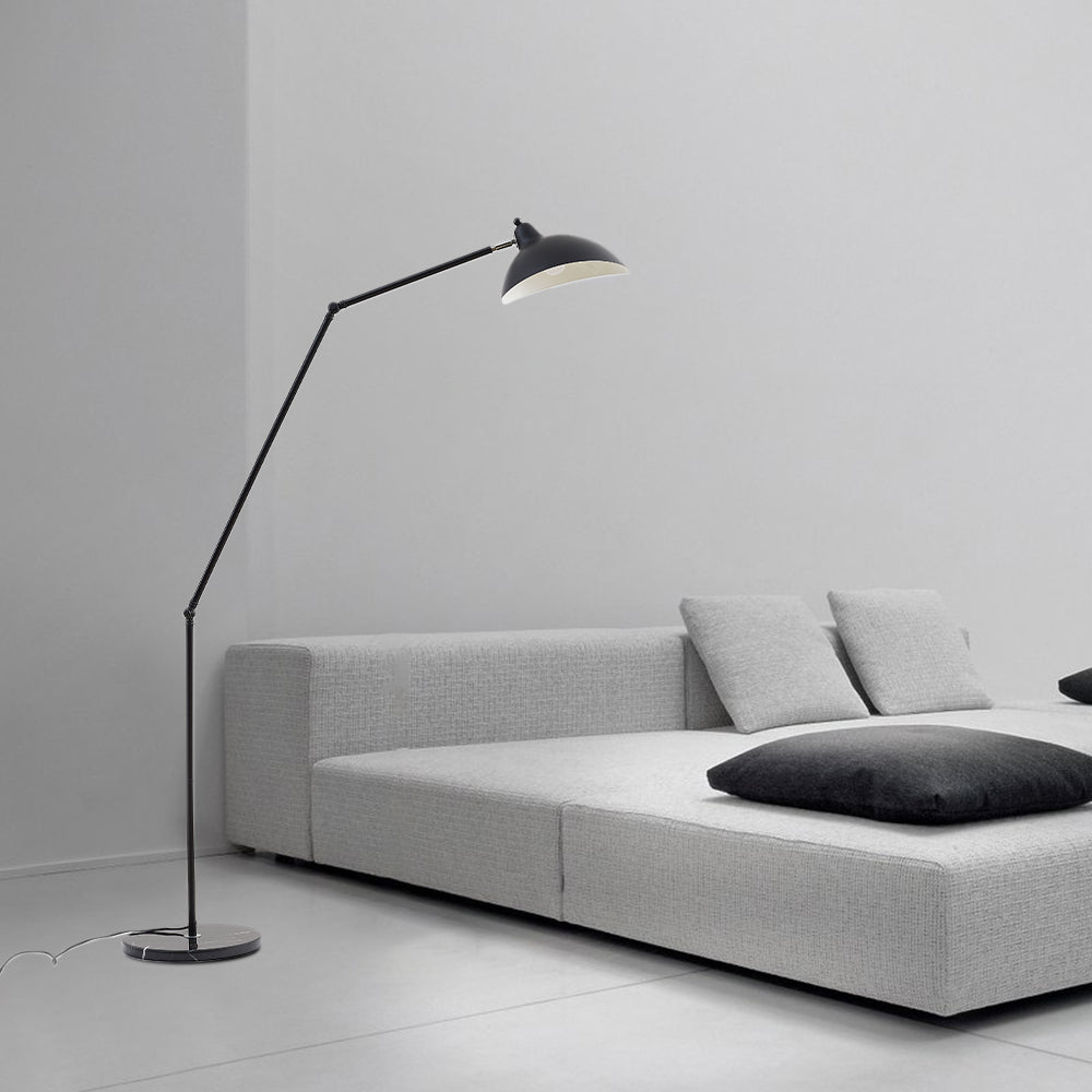 Salgado black floor lamp beside sofa in bedroom