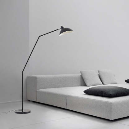 Salgado black floor lamp beside sofa in bedroom