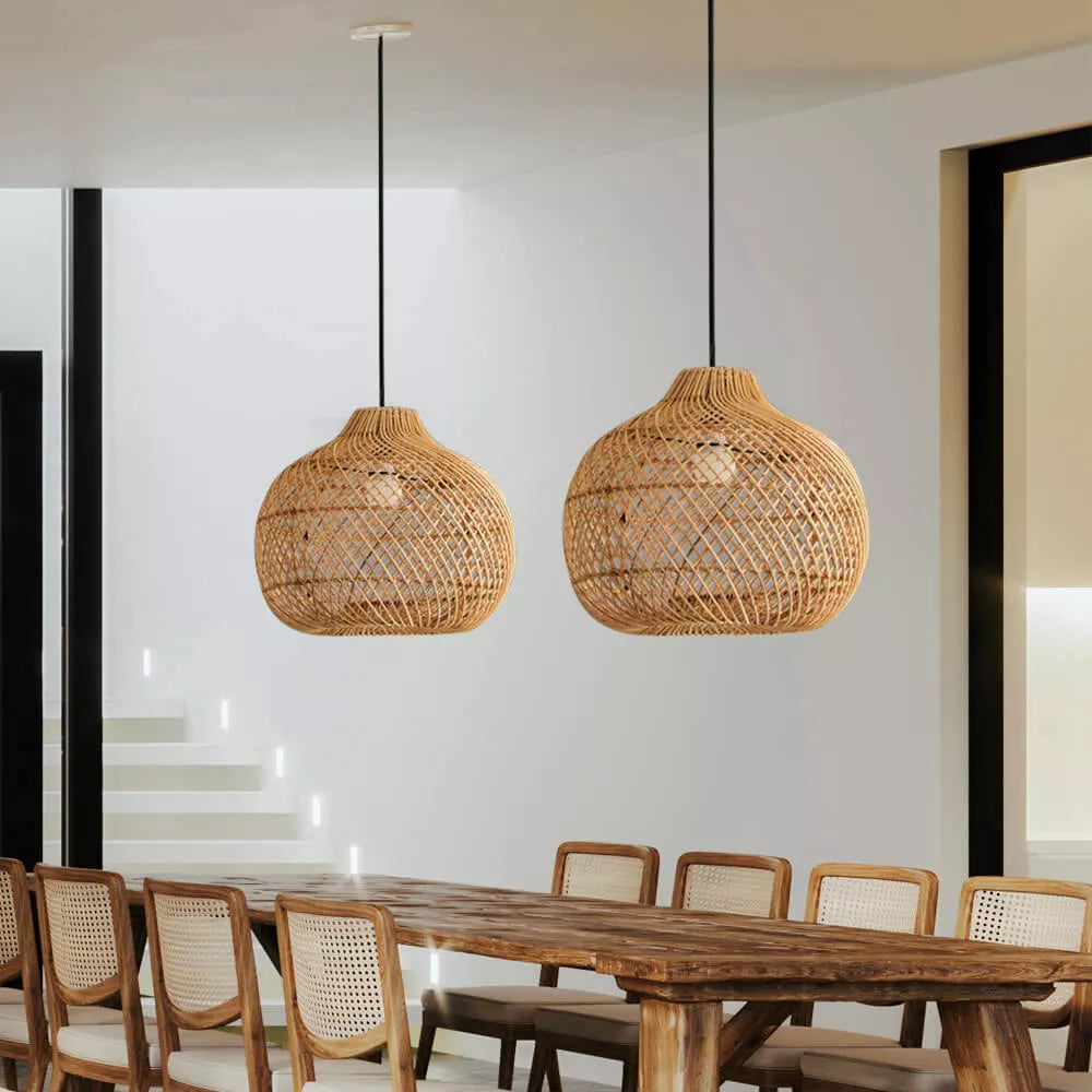 Rattan pendant lights over wooden dining table, Lassola lighting