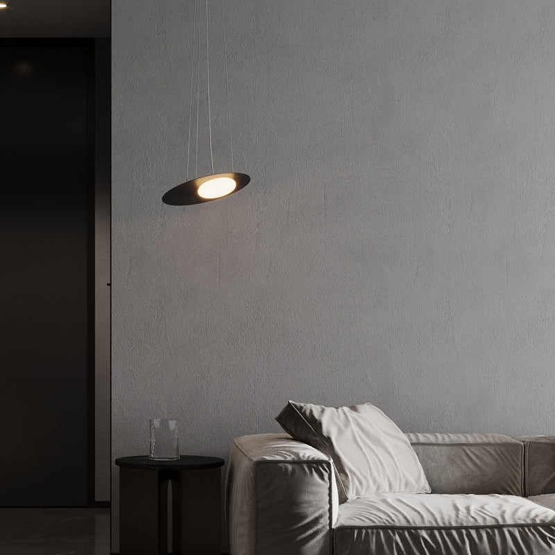 Hailie pendant light illuminating a modern living room