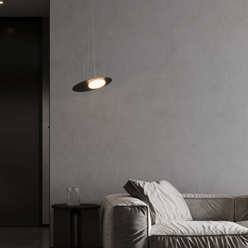 Hailie pendant light illuminating a modern living room