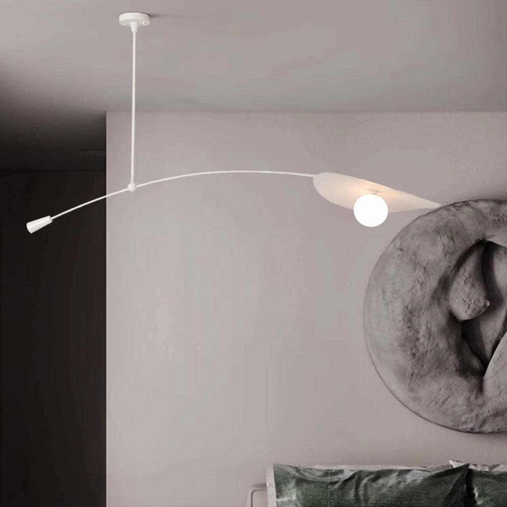 White Cairns leaf pendant light in bedroom setting.