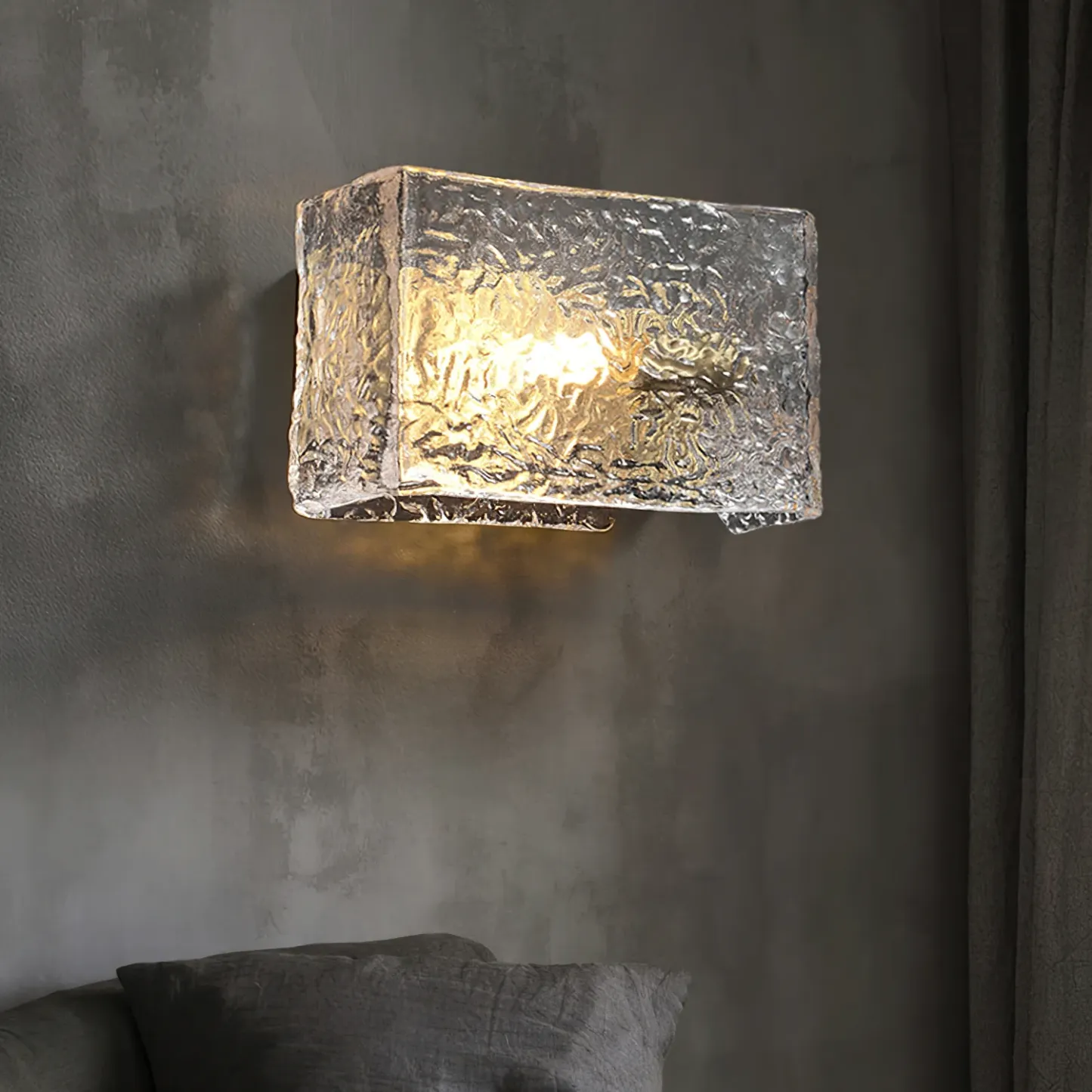 Kristy wall lamp with textured glass, illuminating a room