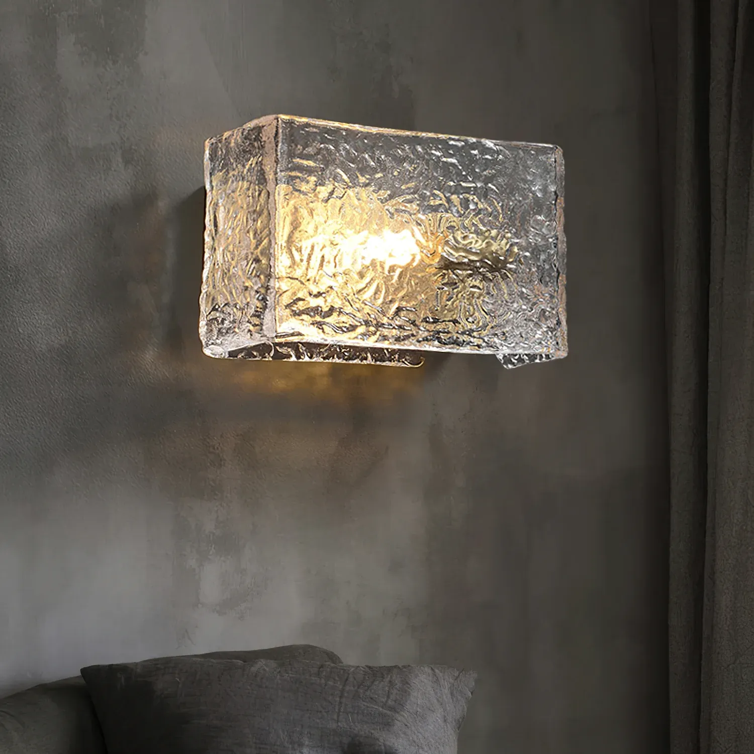 Kristy wall lamp with textured glass, illuminating a room