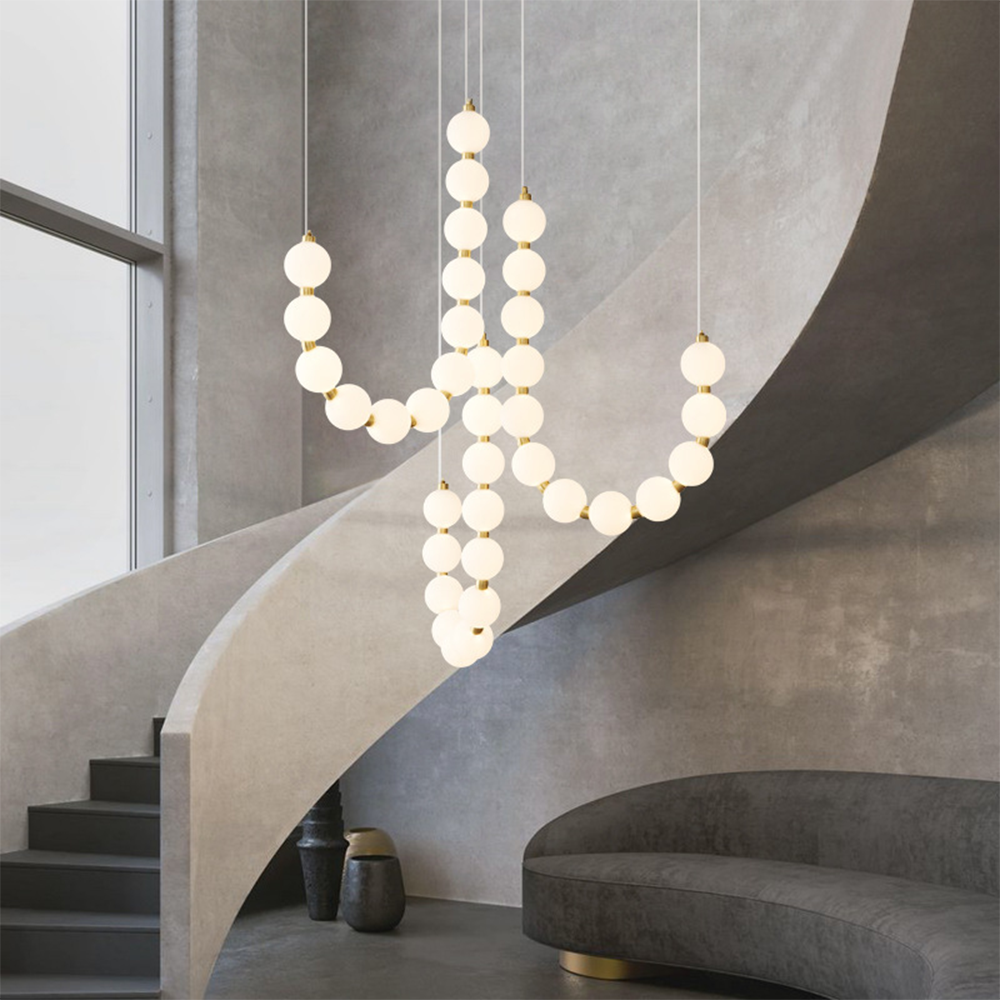 Valentina chandelier in modern interior, staircase, sofa
