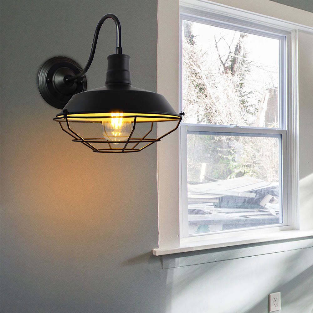 Alessio Wall Lamp with cage detail near window. Vintage style lighting.
