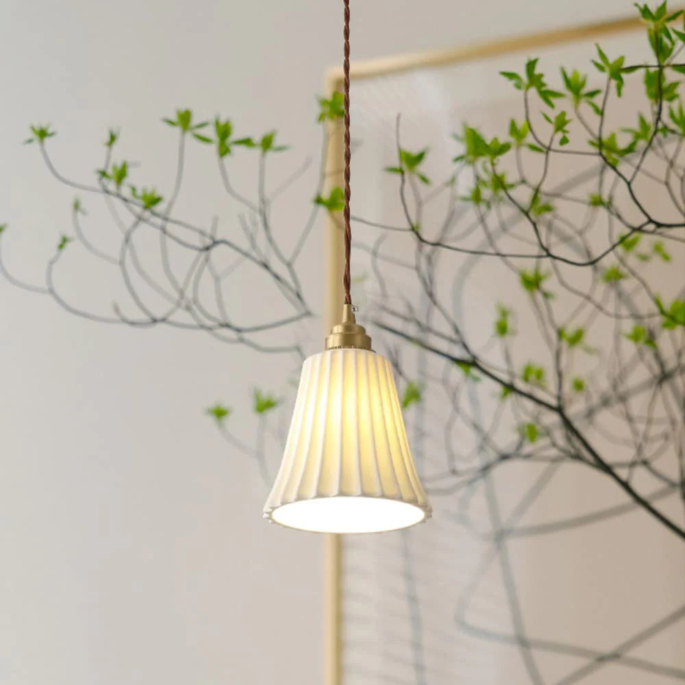 Alessio ceramic pendant light with plant.