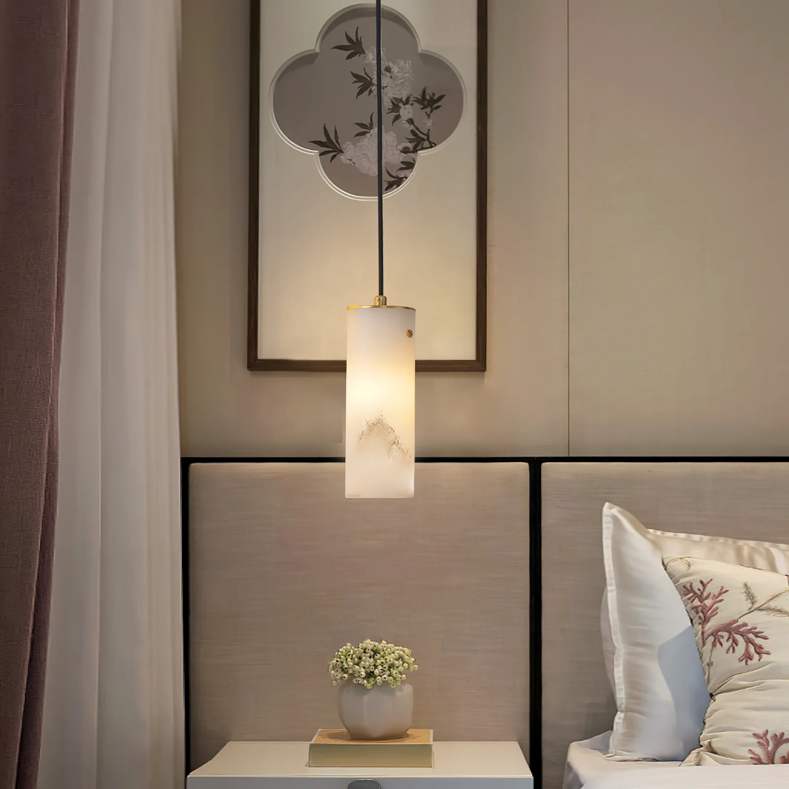Ozawa pendant light illuminating a bedroom, modern lighting fixture