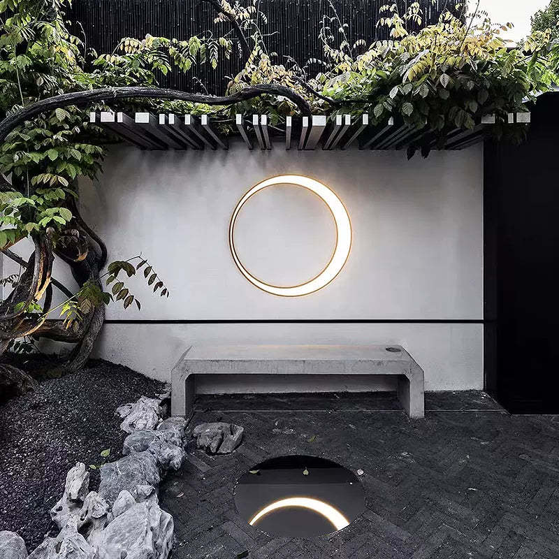 Modern ring LED wall lamp on garden wall