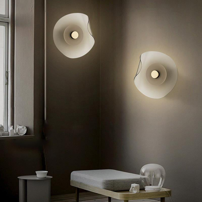 Modern Veta wall lamps in bedroom setting, flower design lighting