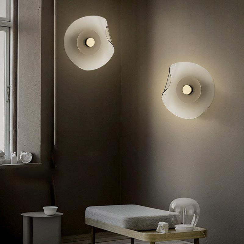Modern Veta wall lamps in bedroom setting, flower design lighting