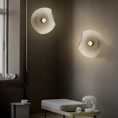 Modern Veta wall lamps in bedroom setting, flower design lighting