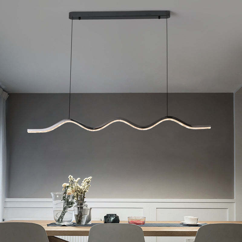 Louise Wave Linear Pendant Light over a dining table, modern design