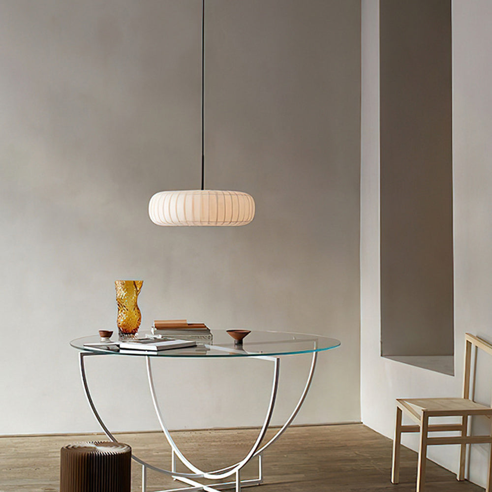 Round fabric pendant light over glass table, modern dining room lighting