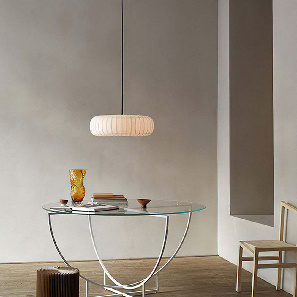 Round fabric pendant light over glass table, modern dining room lighting