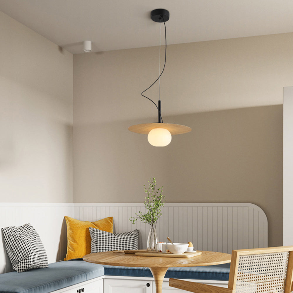 Modern Cairns pendant light above a dining setting
