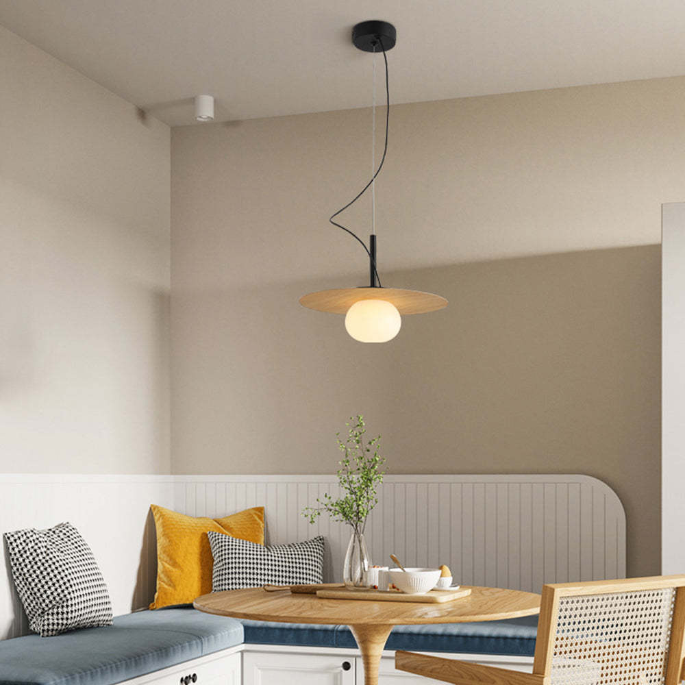 Modern Cairns pendant light above a dining setting